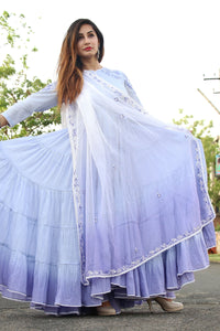 Ghera-e-Naz: Elegant traditional dress with intricate embroidery and vibrant colors displayed on a mannequin.