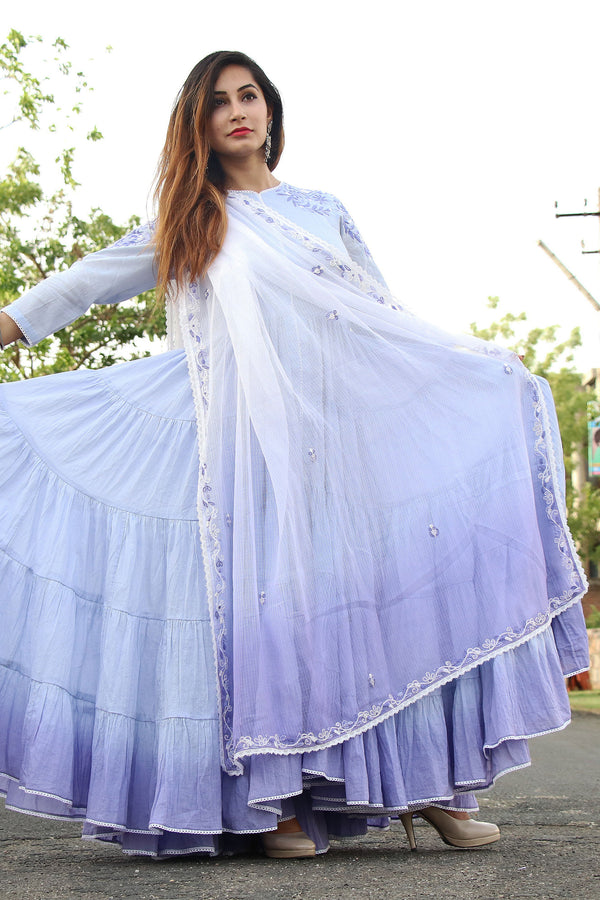 Ghera-e-Naz: Elegant traditional dress with intricate embroidery and vibrant colors displayed on a mannequin.