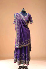 Purple designer lehenga with gold embroidery and matching dupatta on mannequin