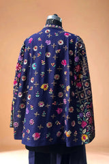 Navy blue designer blazer with intricate multicolor floral embroidery on mannequin
