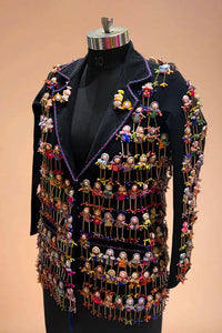 Black designer blazer with colorful miniature dolls hand-embroidered all over the jacket