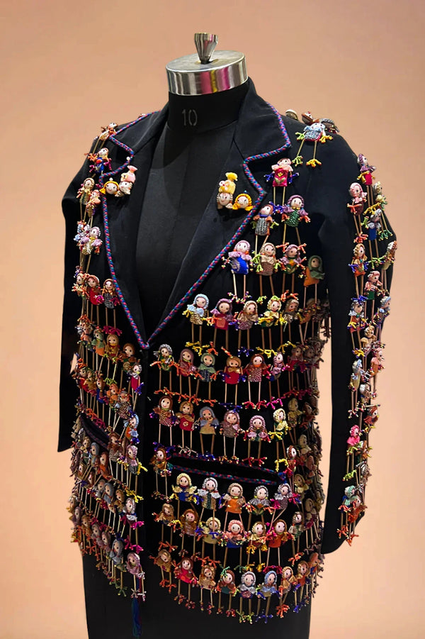 Black designer blazer with colorful miniature dolls hand-embroidered all over the jacket