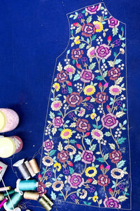 Handcrafted floral embroidery on blue dress fabric with colorful threads, Indian ethnic fashion