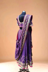 Purple Indian lehenga with gold embroidery and dupatta displayed on a mannequin