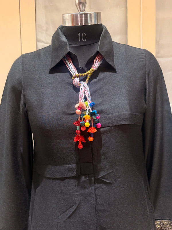 Granthi handcrafted textile necklace displayed on a dark mannequin | Utsavi by Shilpa