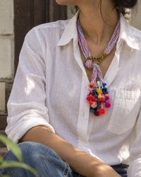 Granthi handcrafted textile necklace worn over a white shirt | Utsavi by Shilpa