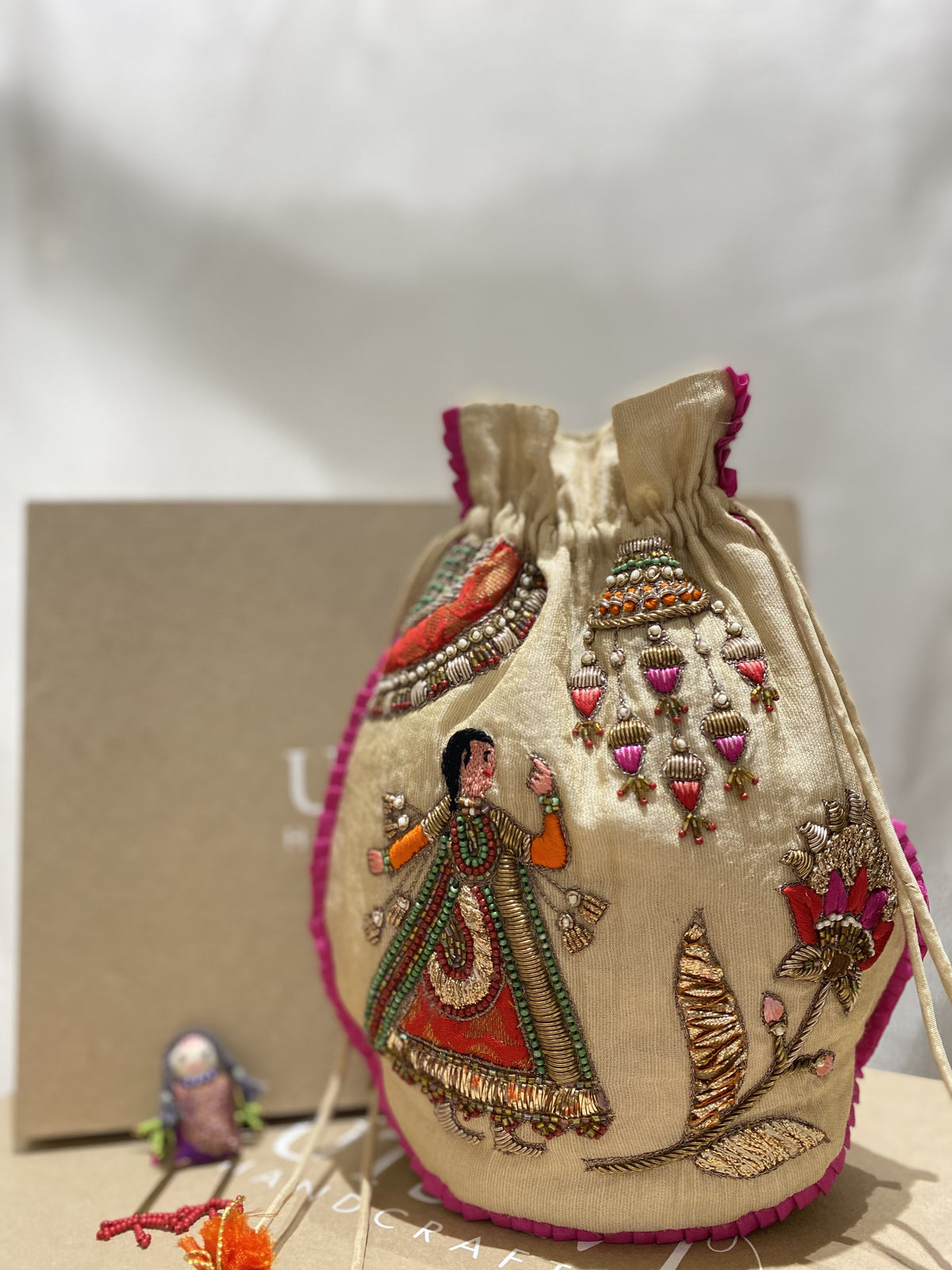 Gulabi Gota handcrafted embroidered potli bag, product photograph 1