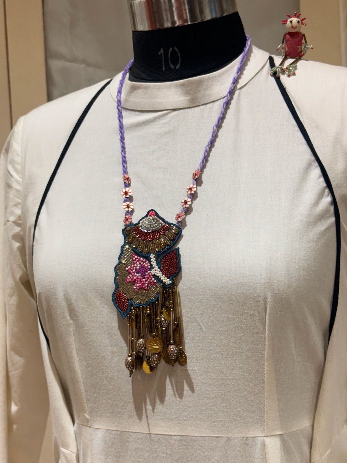 Gulistan handcrafted textile necklace front view over a light garment | Utsavi by Shilpa