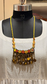 Kusum handcrafted textile necklace front view on a dark mannequin | Utsavi by Shilpa