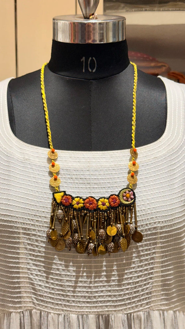 Kusum handcrafted textile necklace front view on a dark mannequin | Utsavi by Shilpa