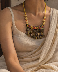 Kusum handcrafted textile necklace worn with a cream sari | Utsavi by Shilpa