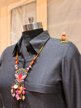 Nisha handcrafted textile necklace displayed on a dark mannequin | Utsavi by Shilpa
