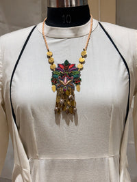 Pallava handcrafted textile necklace pendant displayed over a light garment | Utsavi by Shilpa