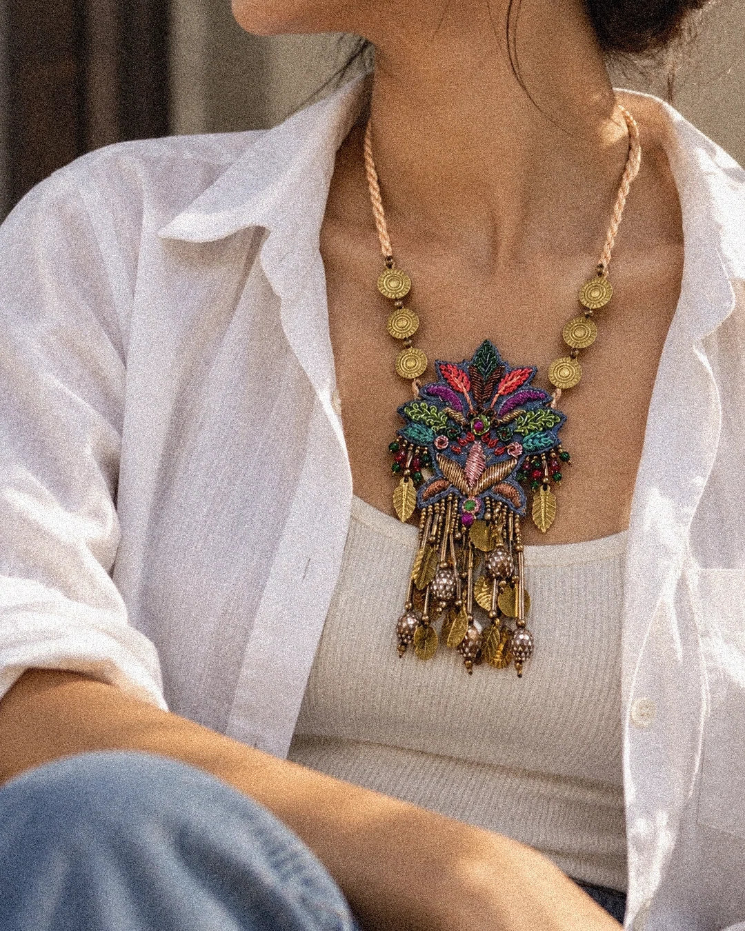 Pallava handcrafted textile necklace worn over a white shirt | Utsavi by Shilpa