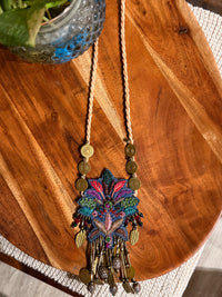 Pallava handcrafted textile necklace embroidered pendant laid on wood | Utsavi by Shilpa