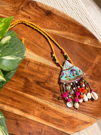 Pallavi handcrafted textile necklace embroidered floral pendant on a wooden surface | Utsavi by Shilpa