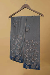 Grey pashmina shawl with beaded circular embroidery, hanging on wooden hanger