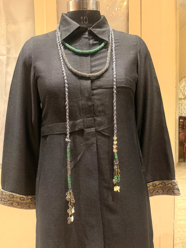 Sangati handcrafted textile necklace long necklace displayed on a dark mannequin | Utsavi by Shilpa