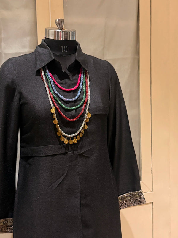 Vinyas handcrafted textile necklace layered necklace displayed on a dark mannequin | Utsavi by Shilpa