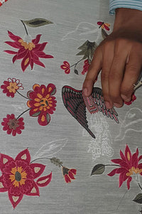 Hand embroidering designer floral and bird motif on luxury ethnic fabric